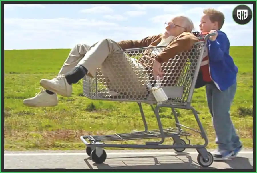 an old man is travelling in a trolly and a kid is standing in Jackass Presents: Bad Grandpa - A 2013 Comedy Movie, best comedy movies