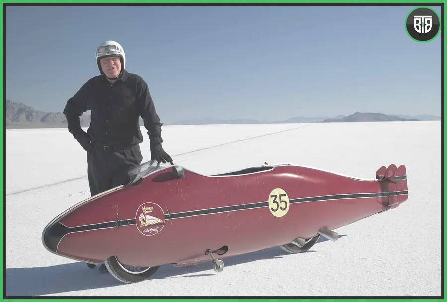 a man is standing near his car in World's Fastest Indian (2005) life changing movies for students